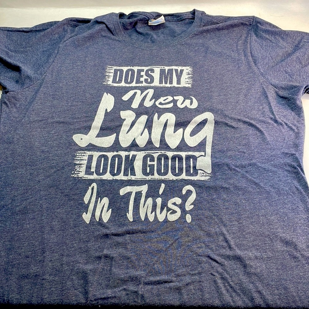 Women’s tee shirt size is Large in grey